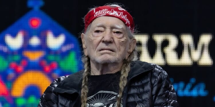 Willie Nelson sits on stage during a press conference in Virginia Beach, Virginia on Sept. 26, 2026.