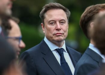 Elon Musk looks at photographers as he visits the White House for an AI conference on September 29, 2026.
