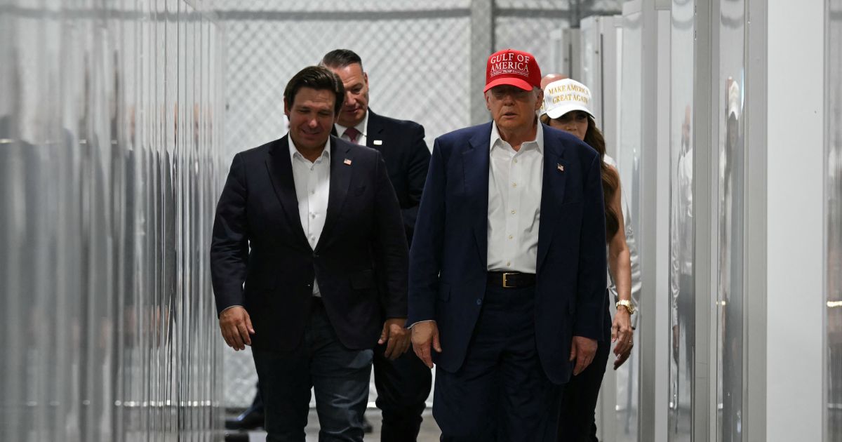 Florida Governor Ron DeSantis, President President Donald Trump, and Homeland Security Secretary Kristi Noem tour a medical facility during a visit to a migrant detention center dubbed "Alligator Alcatraz," located at the site of the Dade-Collier Training and Transition Airport in Ochopee, Florida, on July 1, 2025.