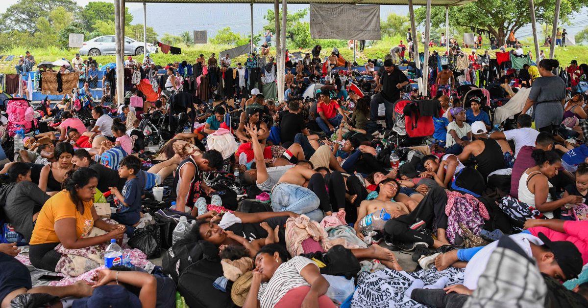 Migrants, mostly from Central America and Venezuela, rest on their way to the United States in Huixtla, Mexico, on July 24.