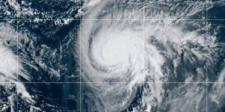 Hurricane watch: Two neighboring storm systems could end up shielding the Carolinas