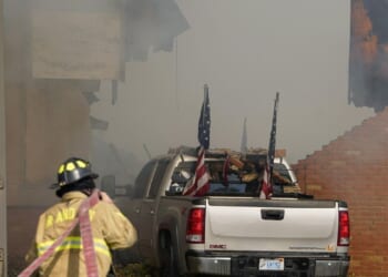 Police remain on scene at burned out Michigan church after shooting and fire