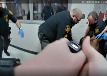 Family says Ohio county agrees to $7M settlement over man's death after jail guards restrained him