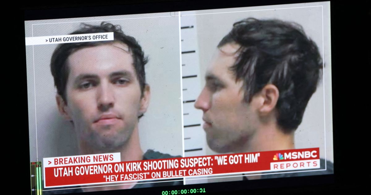 A TV monitor displays a picture of Tyler Robinson, the suspected of killing Charlie Kirk on Sept. 10, 2025, in Orem, Utah.