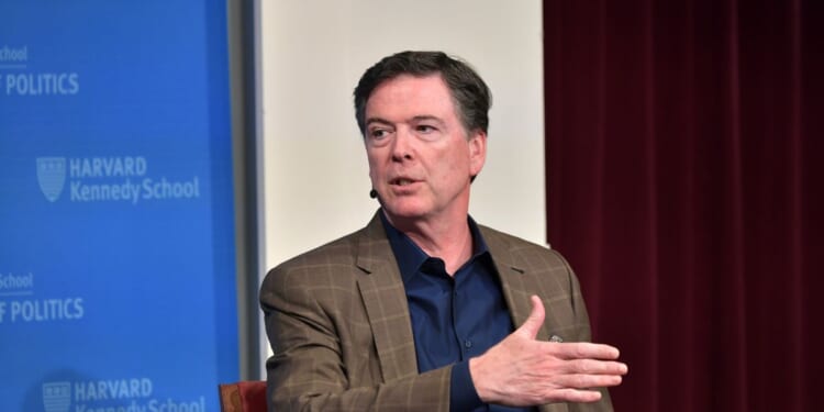 Former FBI Director James Comey speaks at Harvard Kennedy School with Harvard's Eric Rosenbach on Feb. 24, 2020, in Boston, Massachusetts.