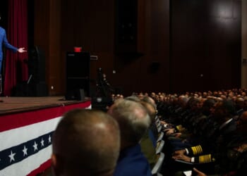 Secretary of War Pete Hegseth, left, speaks to senior military leaders at Marine Corps Base Quantico in Quantico, Virginia, on Tuesday.