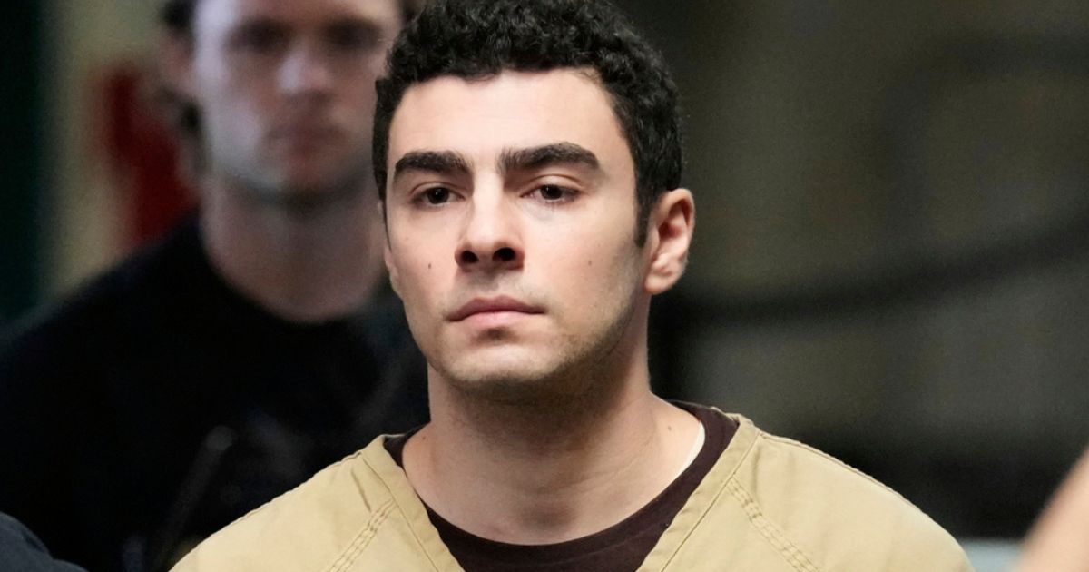 Luigi Mangione is escorted into Manhattan state court in New York City on Tuesday.