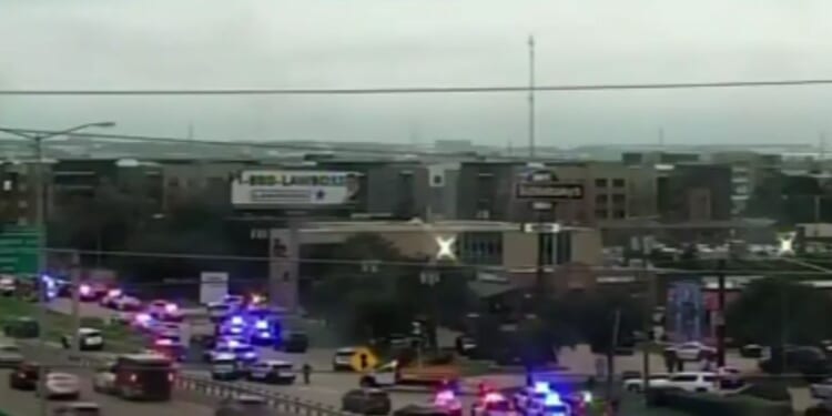 Police respond to the scene of a shooting at an ICE facility in Dallas, Texas, on Wednesday.