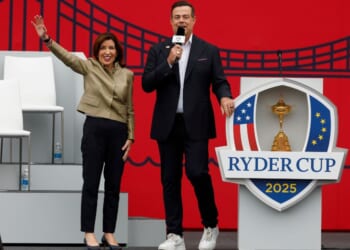 Kathy Hochul, governor of New York, and Carson Daly speak to the crowd Wednesday during the opening ceremony for the 2025 Ryder Cup at Black Course at Bethpage State Park Golf Course in Farmingdale, New York.