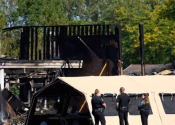 Woman who was confronted by Michigan church gunman says she instantly forgave him for killing dad