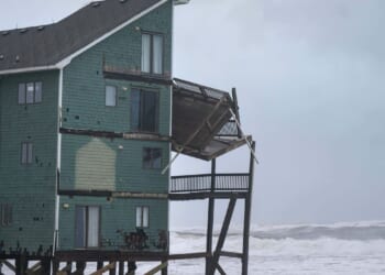 Dozens rescued as remnants of typhoon slam Alaska while nor'easter brings flooding to East Coast