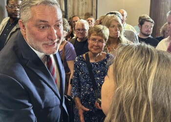 John Reid puts an AI twist on empty-chair debate routine in Virginia's lieutenant governor race