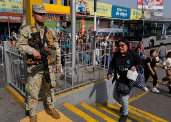 Military and police patrol streets of Peru's capital as state of emergency begins