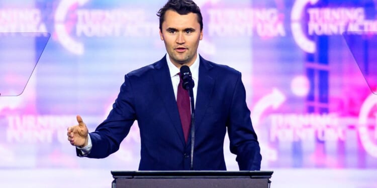 Charlie Kirk speaks on stage at America Fest 2024 in Phoenix, Arizona, on Dec. 22, 2024.