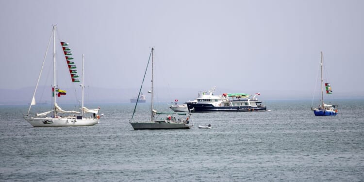 Activists aboard flotilla approach Gaza and say they are ready for a possible Israeli interception