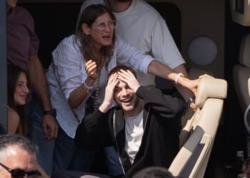 Former hostage Alon Ohel waves to supporters outside Beilinson Hospital in the Rabin Medical Centre in Petah Tikva, Israel, on Monday.