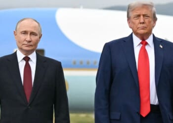 President Donald Trump and Russian President Vladimir Putin pose on a podium at Joint Base Elmendorf-Richardson in Anchorage, Alaska, on Aug. 15.