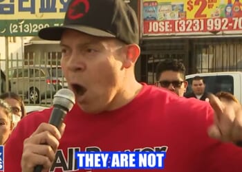 A school teacher identified as Ron Gochez is under investigation for telling a crowd "they're not the only ones with guns!" during an anti-ICE protest.