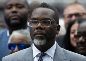 Chicago Mayor Brandon Johnson listens as Illinois Gov. J.B. Pritzker speaks at a news conference to address President Donald Trump's plan to send National Guard troops into the city on Aug. 25, 2025, in Chicago, Illinois.