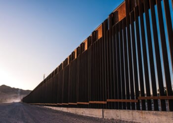A service road sits next to the U.S. Southern Border Wall in El Paso, Texas.