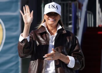 First lady Melania Trump takes the stage as she prepares to make remarks during the Navy 250 Celebration aboard the USS Harry S. Truman aircraft carrier in Naval Station Norfolk, Virginia, on Sunday.
