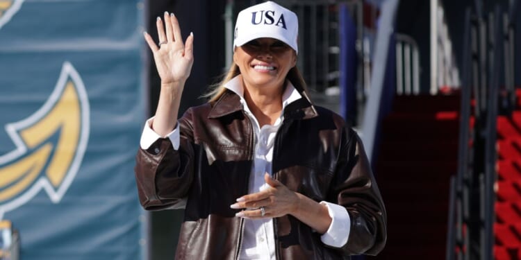 First lady Melania Trump takes the stage as she prepares to make remarks during the Navy 250 Celebration aboard the USS Harry S. Truman aircraft carrier in Naval Station Norfolk, Virginia, on Sunday.