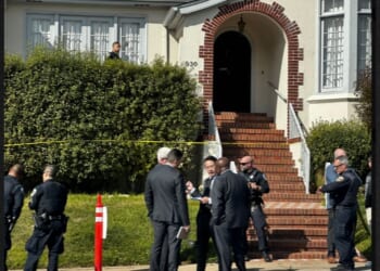 Investigators gather outside a San Francisco home where four bodies were found, including two children.