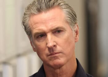 Gov. Gavin Newsom listens before speaking during a news conference in Los Angeles, California, on Thursday.