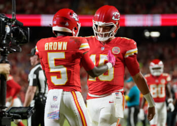 Kansas City Chiefs wide receiver Hollywood Brown is congratulated by quarterback Patrick Mahomes after scoring during the second half of an NFL football game against the Detroit Lions on Oct. 12, 2025, in Kansas City, Missouri.