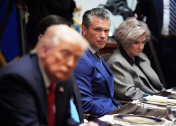 Defense Secretary Pete Hegseth listens as he and White House Chief of Staff Susie Wiles, right, listen during a meeting Monday with President Donald Trump, in foreground left, and Australian Prime Minister Anthony Albanese at the White House in Washington, D.C.