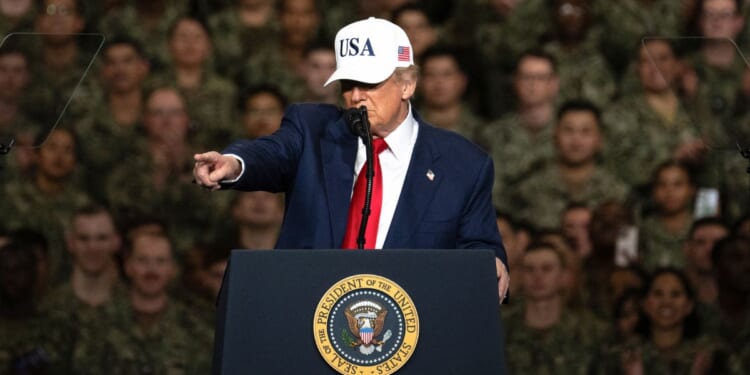 President Donald Trump delivers a speech to U.S. Navy personnel on board the USS George Washington aircraft carrier at the US naval base in Yokosuka, Japan, on Tuesday.