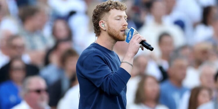 JP Saxe sings the Canadian National Anthem Monday before game three of the 2025 World Series between the Toronto Blue Jays and the Los Angeles Dodgers at Dodger Stadium in Los Angeles, California.