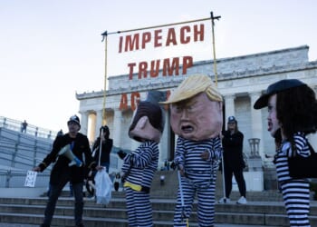 Activists from Free Speech For People dressed as Vice President J.D. Vance, Secretary of Homeland Security Kristi Noem, President Donald Trump, and White House Deputy Chief of Staff Stephen Miller participate in a rally at the Lincoln Memorial on Oct. 17, 2025, in Washington, D.C.