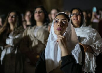 Egyptian Coptic Christians attend the Resurrection Mass at the Monastery of Saint Simon Al-Kharaz during Holy Saturday services on April 19 in Cairo, Egypt.