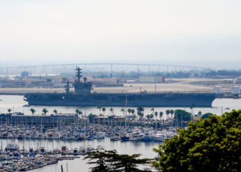 The USS Nimitz departs San Diego Bay at Mission Beach, in San Diego, California, on Aug. 19, 2023.