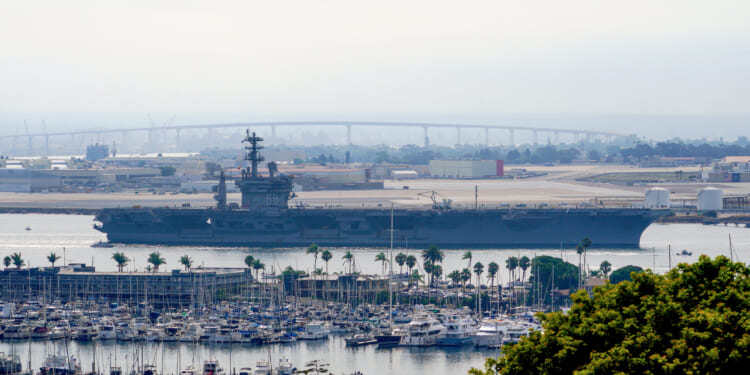 The USS Nimitz departs San Diego Bay at Mission Beach, in San Diego, California, on Aug. 19, 2023.