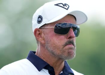 Phil Mickelson stands on the 14th hole on day one of LIV Golf Chicago in Bolingbrook, Illinois, on Aug. 8.