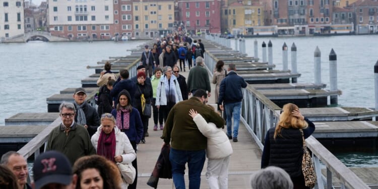 Venice revives a quarter-mile floating bridge to island cemetery for All Souls' Day mourners