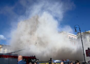 Rescuers working to reach worker trapped in medieval tower that partially collapsed in Rome