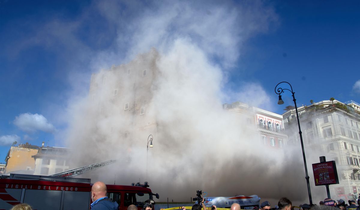 Rescuers working to reach worker trapped in medieval tower that partially collapsed in Rome