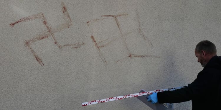 Police detain man, 31, who allegedly painted swastikas with own blood on cars, buildings in Germany