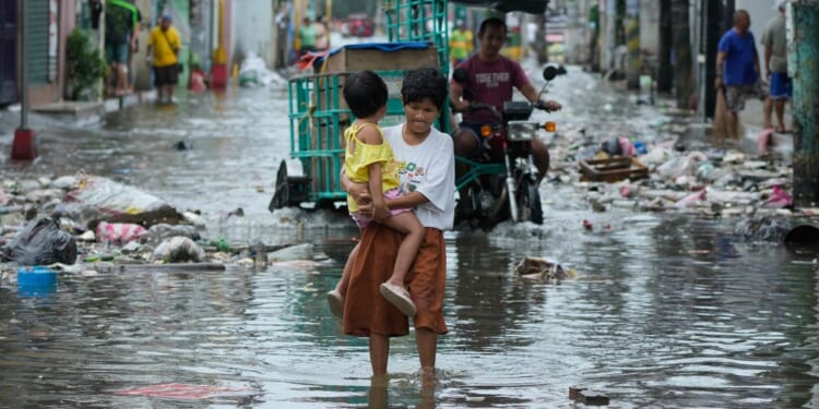 Typhoon Fung-wong blows away from the Philippines, leaving 8 dead and 1.4 million displaced