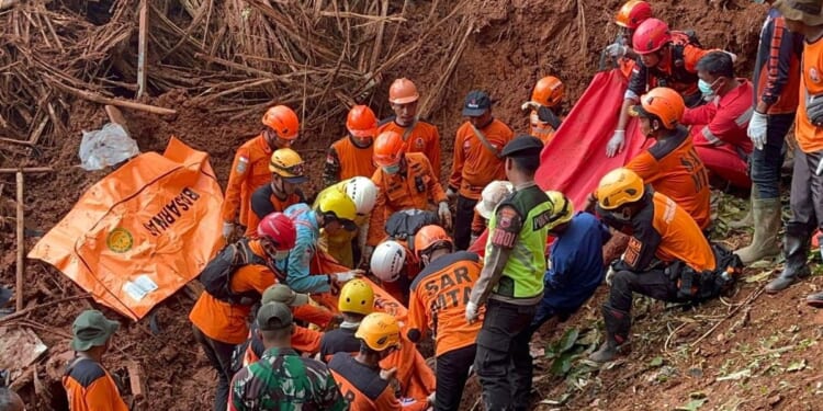 Indonesian rescuers search for nearly three dozen people after landslides killed at least 18 people