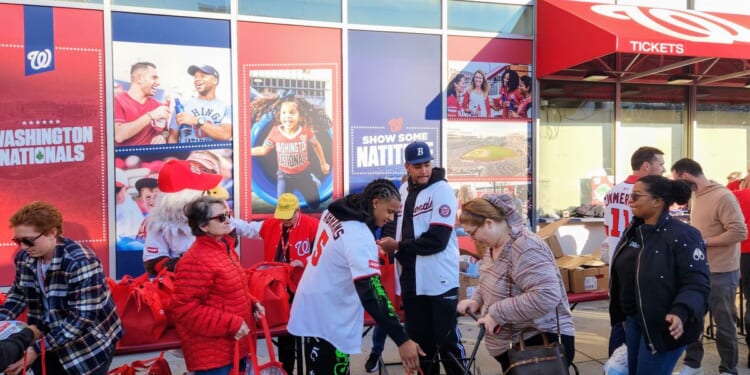 C.J. Abrams, James Wood dish out Thanksgiving meals to families in need at Nationals Park