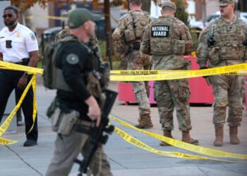 Members of law enforcement and National Guard soldiers respond to a shooting near the White House on Nov. 26, 2025, in Washington, D.C.
