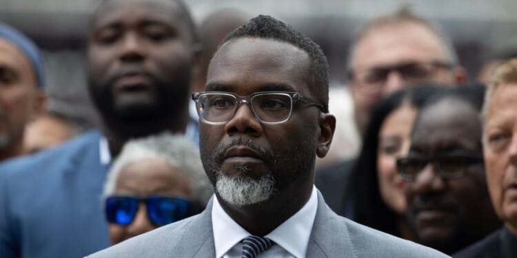 Chicago Mayor Brandon Johnson listens as Illinois Gov. J.B. Pritzker speaks at a news conference to address President Donald Trump's plan to send National Guard troops into the city on Aug. 25, 2025, in Chicago, Illinois.