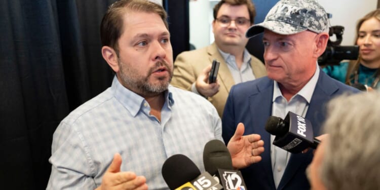 Sen. Ruben Gallego, left, an Arizona Democrat, appeared to threaten "consequences" for military service members who take part in a potential court-martial of his colleague, Democratic Sen. Mark Kelly of Arizona, right. The two are seen discussing Medicaid budget cuts at a March news conference in Scottsdale, Arizona.