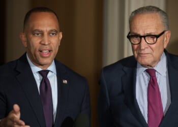 US Senate Minority Leader Sen. Chuck Schumer stands next to House Minority Leader Rep. Hakeem Jeffries as they brief members of the news media regarding the government shutdown at the U.S. Capitol in Washington, DC on Oct. 16, 2025.