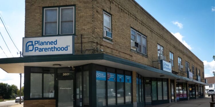 A sign hangs above the front door of a Planned Parenthood clinic on Sept. 25, 2025, in Kenosha, Wisconsin.
