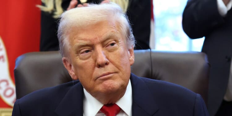President Donald Trump looks on during the swearing-in ceremony of U.S. Ambassador to India Sergio Gor in the Oval Office of the White House on Nov. 10, 2025, in Washington, D.C.
